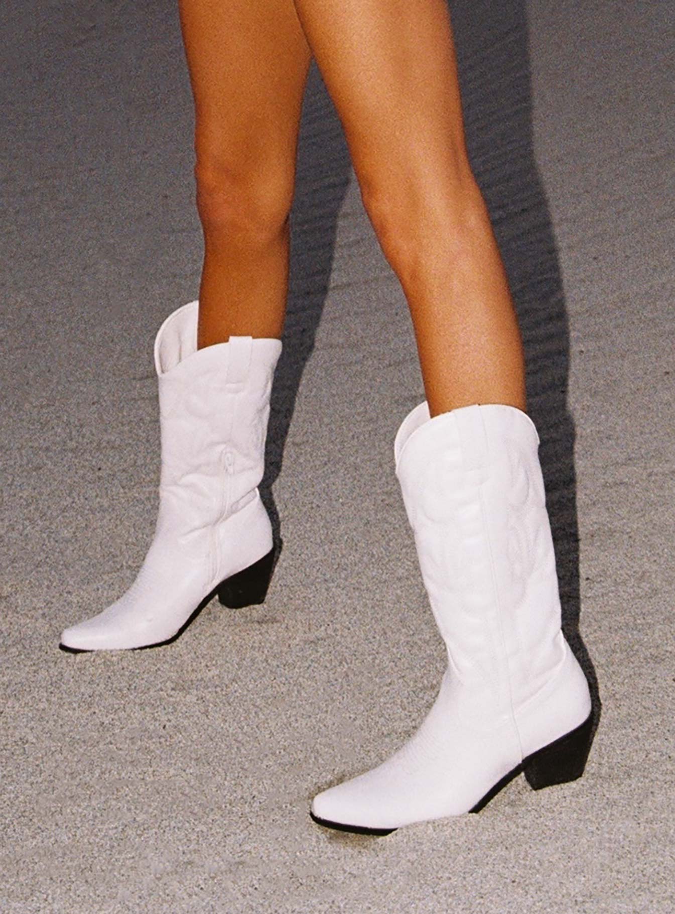 woman wearing white cowgirl boots 2025